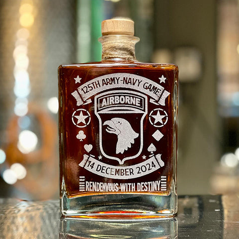 Bottle of liquor with a military-themed label on a reflective surface